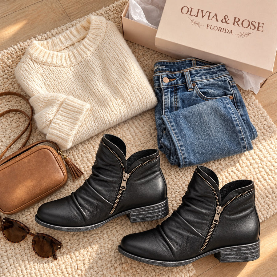 The Melinda ankle boots with jeans, a cream sweater and a tan bag