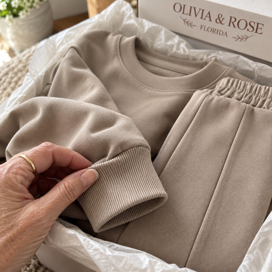 The elasticated waist of the Noor trousers in its Olivia & Rose box