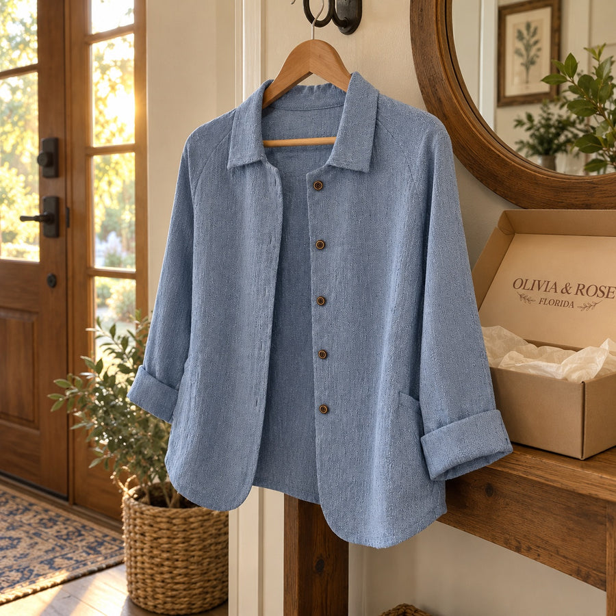 The Wilhelmine blouse on a hanger by the front door