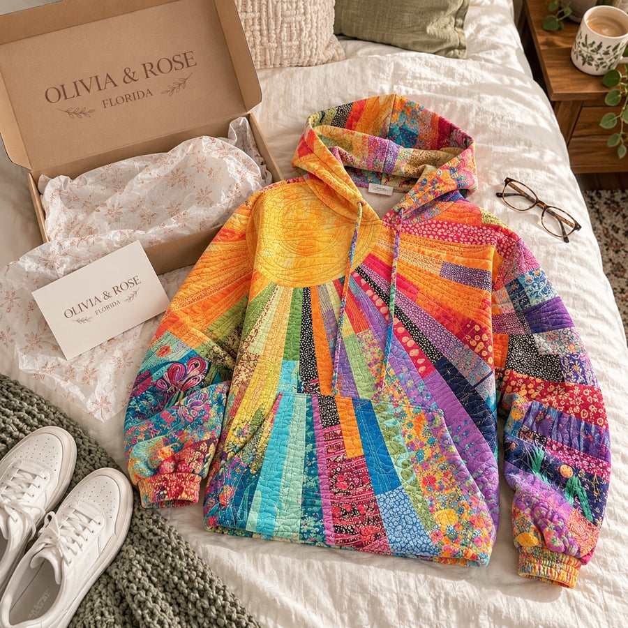 The Amanda hoodie laid out on a bed next to its Olivia & Rose box