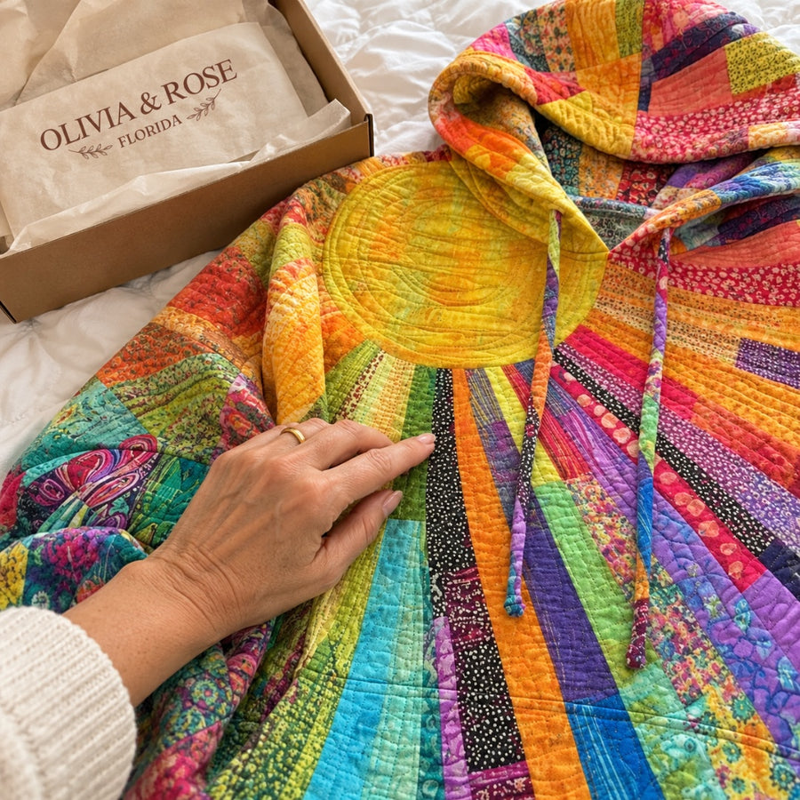 Close-up of the stitched patchwork sun on the Amanda hoodie