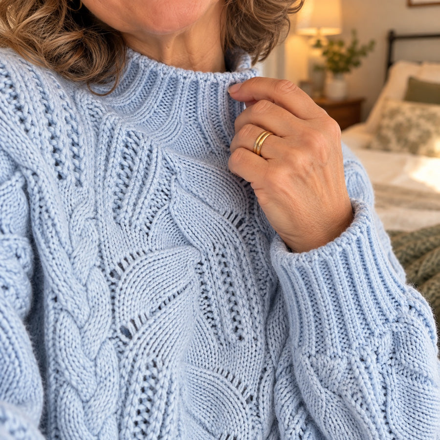 Close-up of the soft cable knit of the Aurora