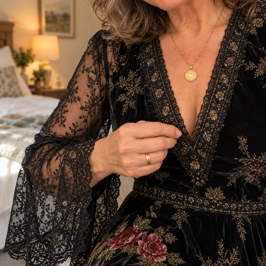 Close-up of the lace bell sleeve and V-neckline of the Natalie